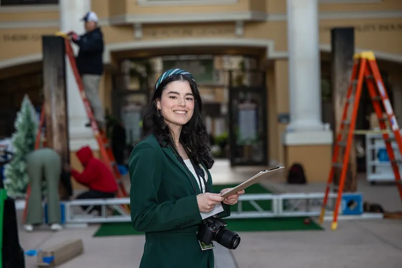 A Rosen College student producer during Career Fair build-out