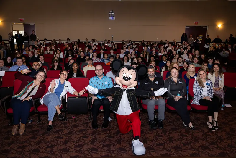 Rosen College students filling the auditorium for Disney Day
