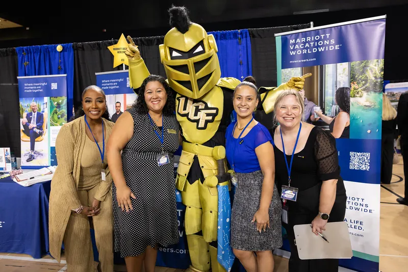 Marriott Vacations Worldwide recruiters at their booth during the Rosen College Career Fair