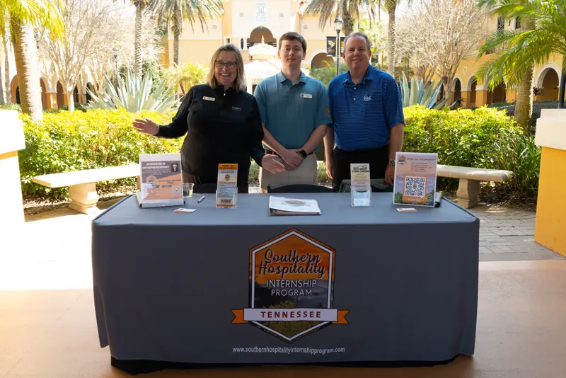 Southern Hospitality Internship Program representatives at their table outside Rosen College