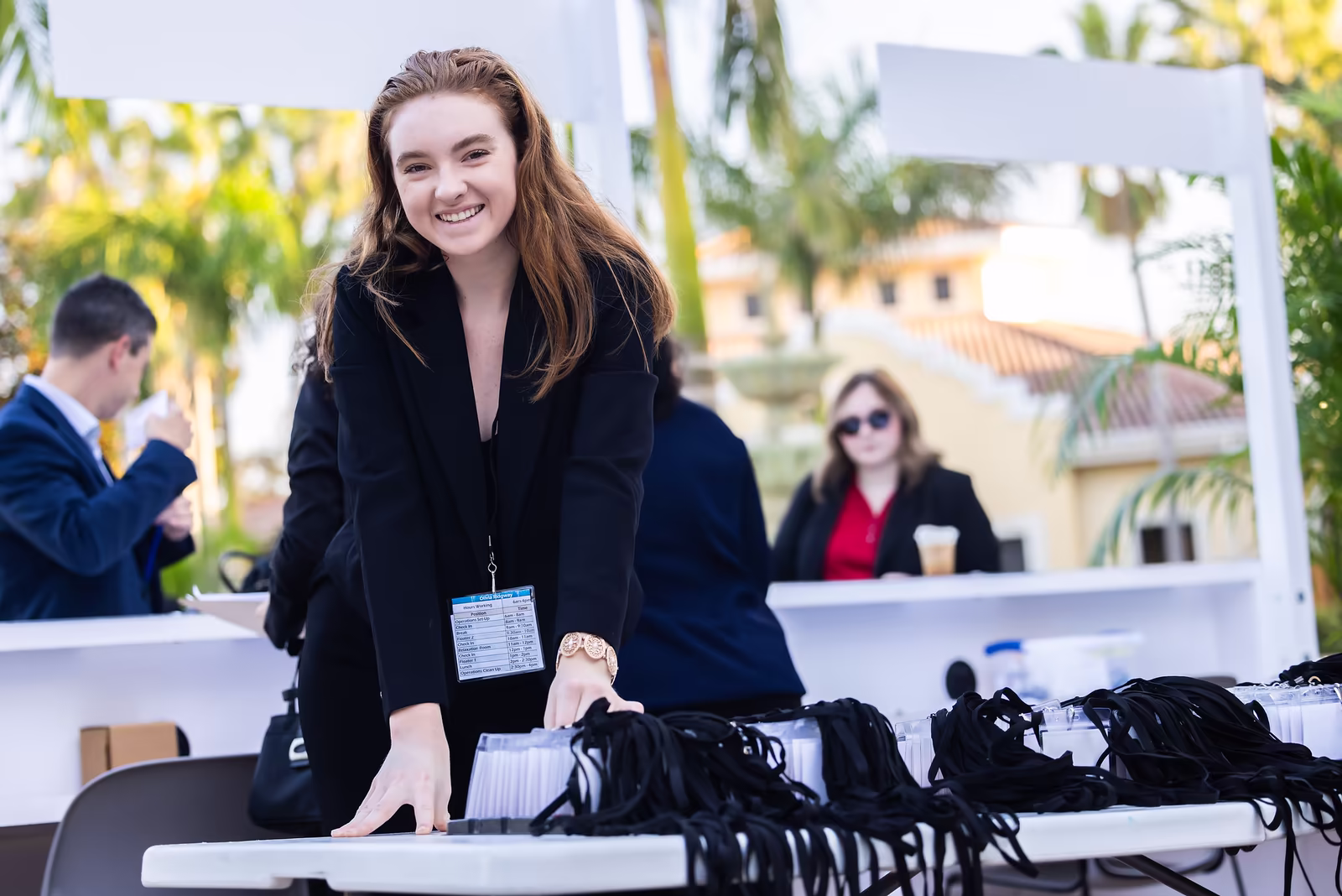 Students at the lanyard table during the Rosen College Career Fair