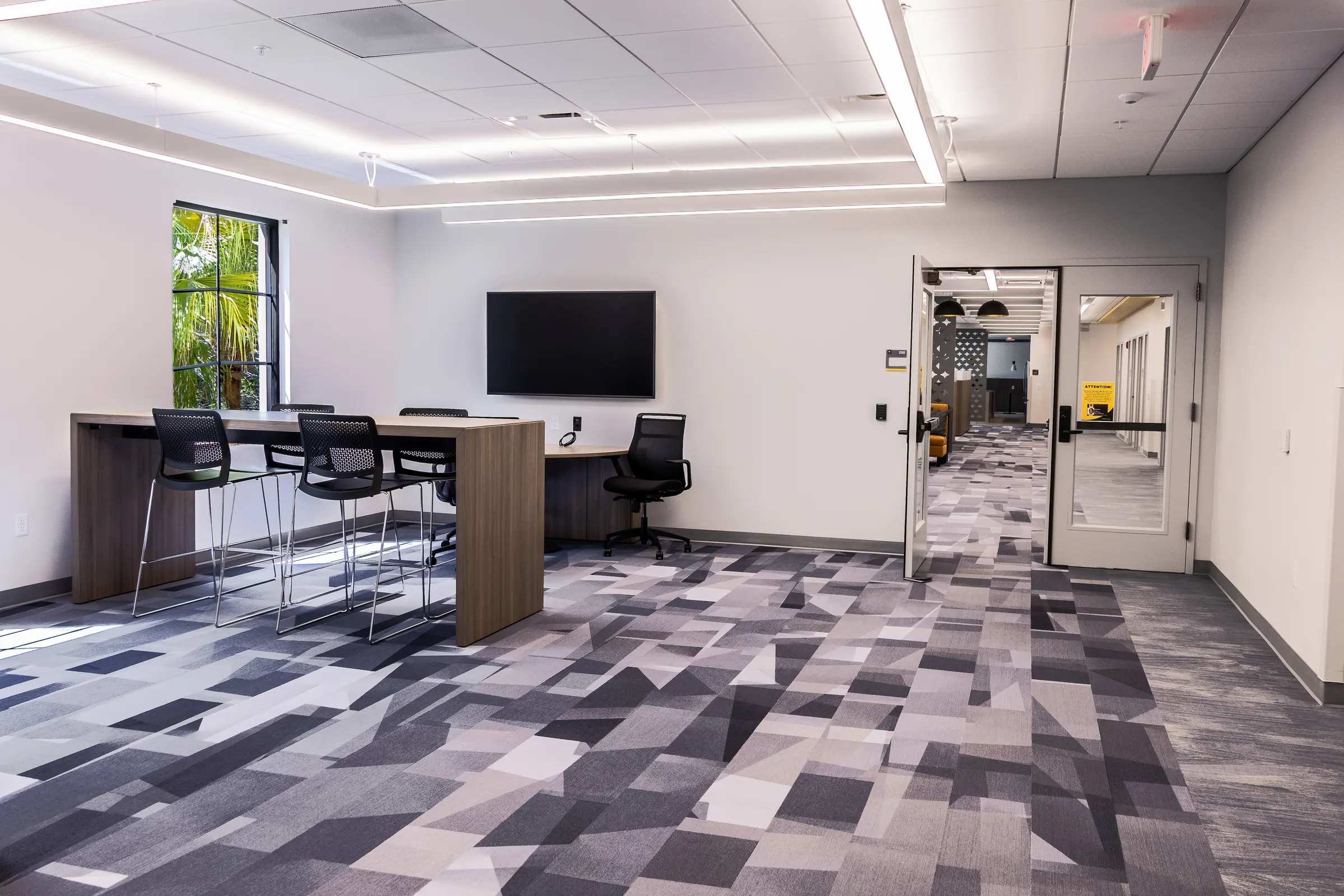 Collaboration Room with work table and display screen